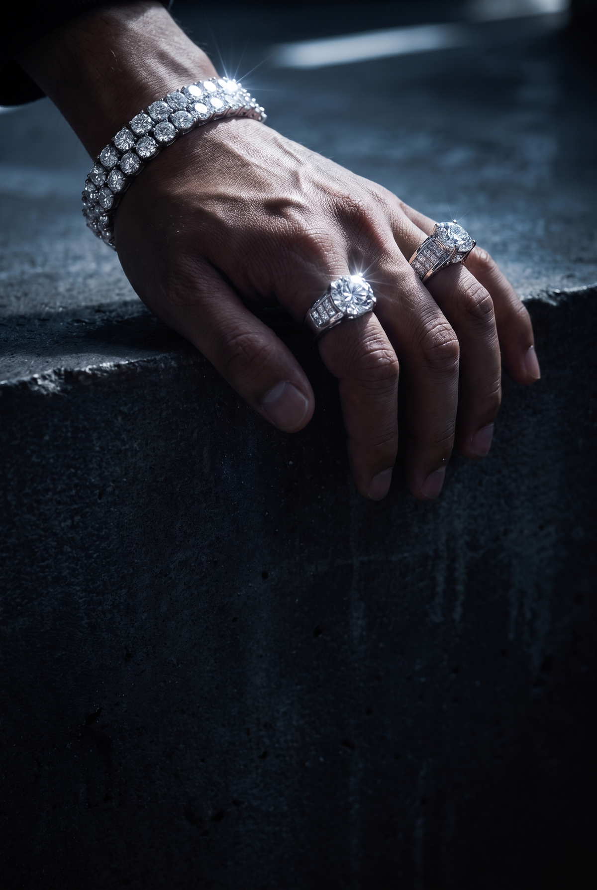 Silver bracelet and moissanite rings in raking light